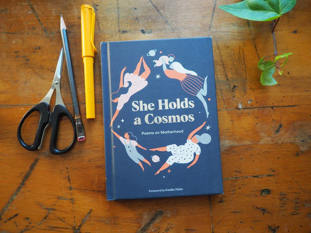 She Holds a Cosmos: Poems on Motherhood